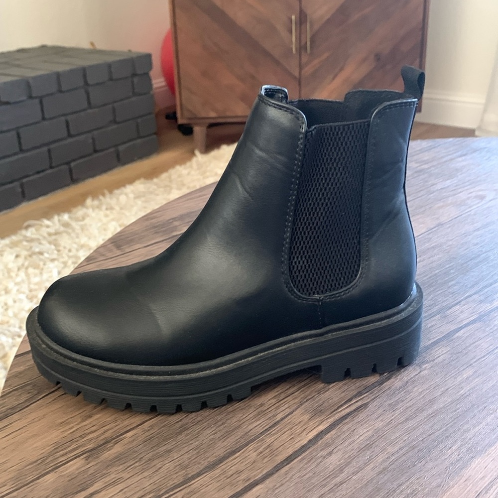 New with no box.   Black lug sole boot.  Staple for any closet.